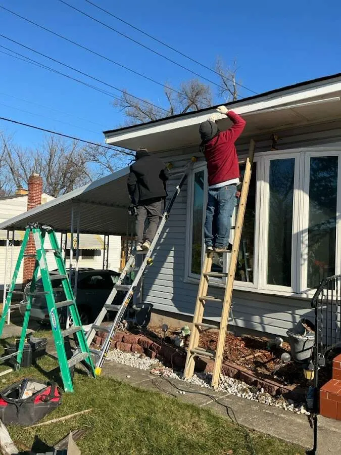 Restoration crew performing exterior repair in Elmwood